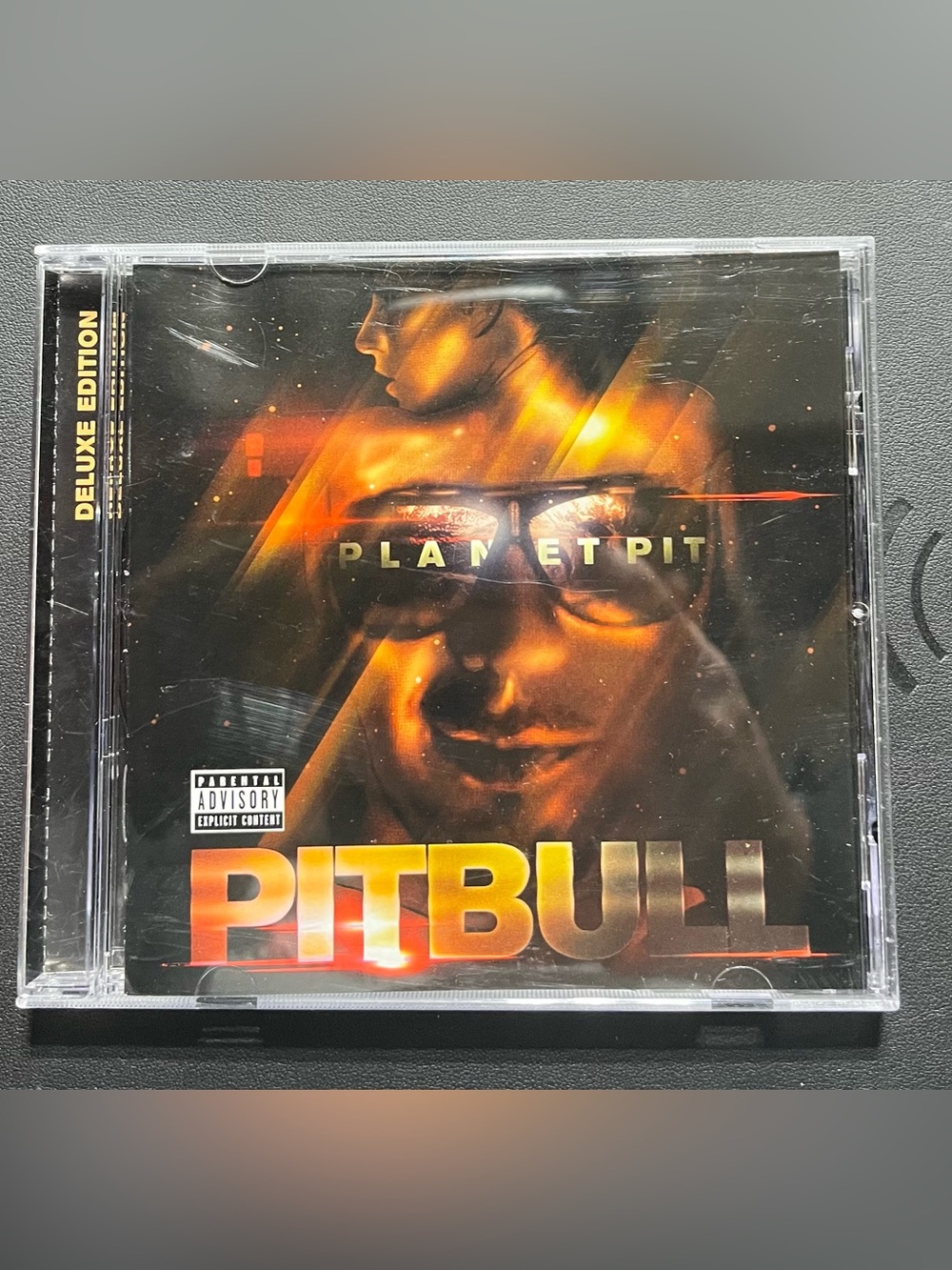 CD- Planet Pit (Deluxe Edition) album by Pitbull, released in June 2011.